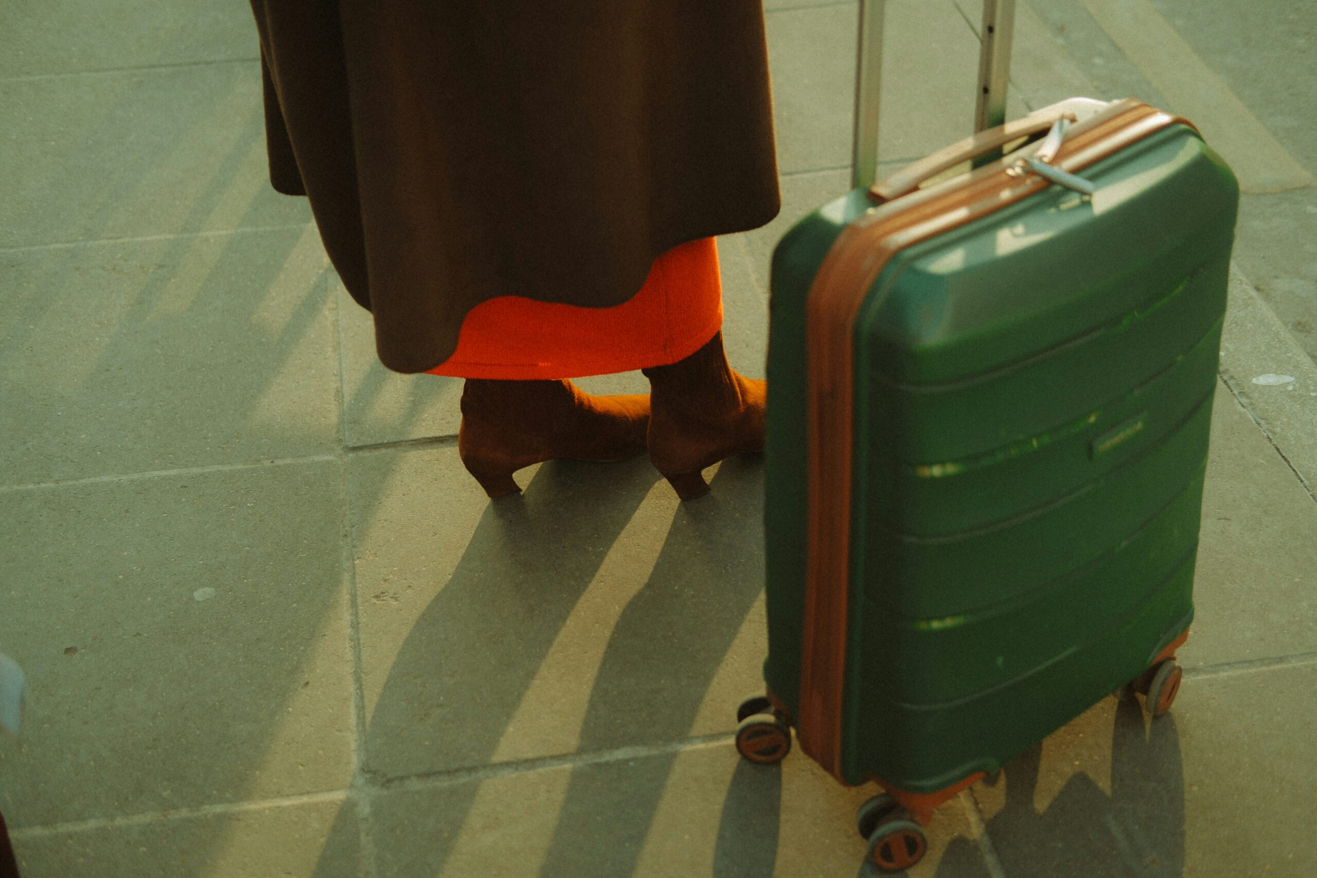 Different colorful and patterned hardshell suitcases lined up