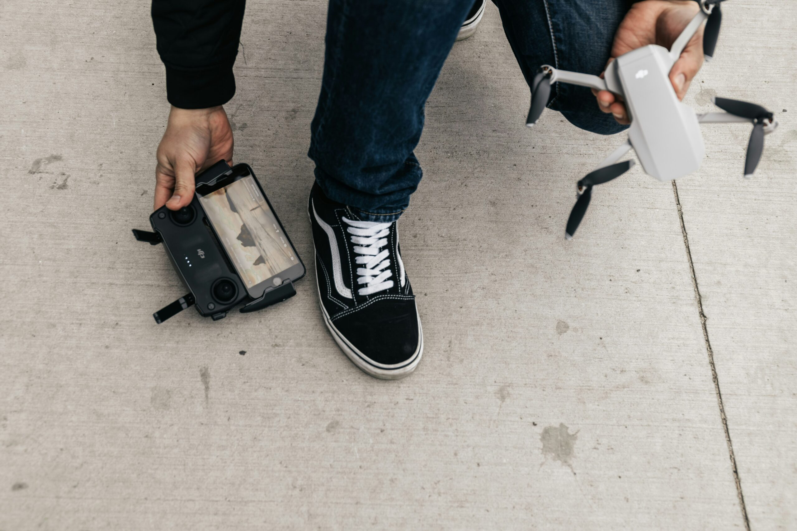 Photo of a traveler holding up their suitcase protected by heavy-duty corner guards still looking pristine after many trips