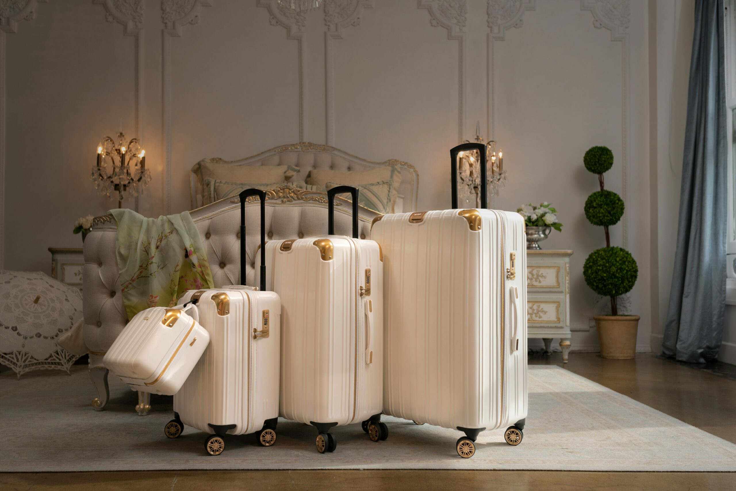 Rimowa, Tumi, and Away suitcases lined up side by side