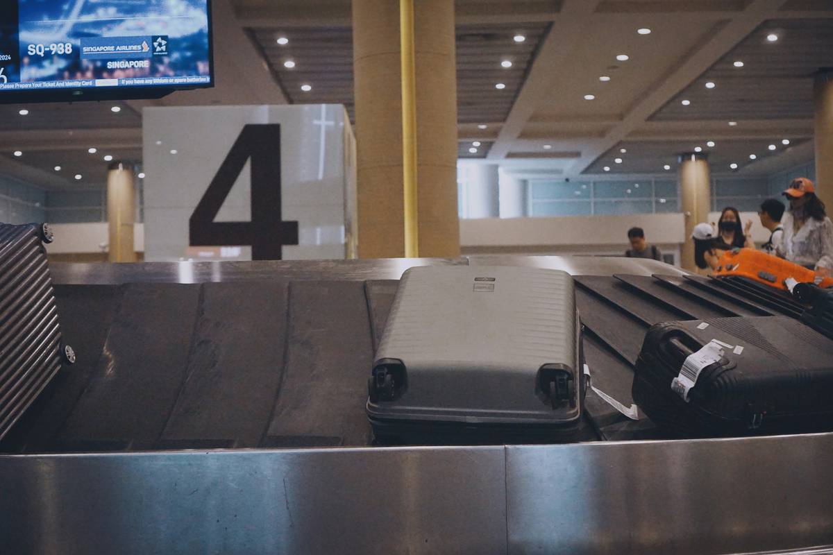 A high-quality polycarbonate hardshell suitcase in silver.