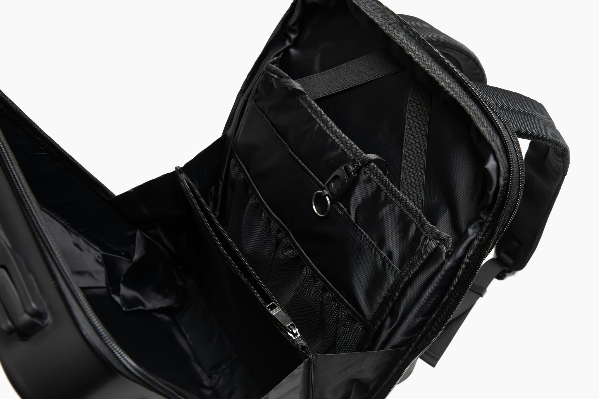 An armored travel bag neatly packed with clothes and accessories inside