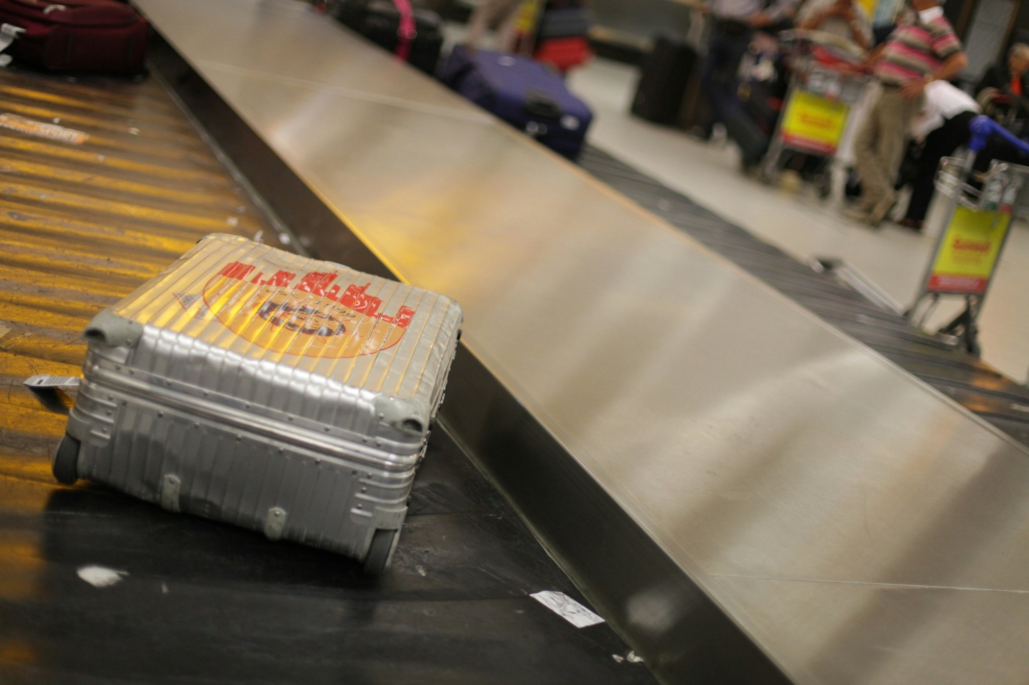 Closeup of smooth-rolling trolley wheels on suitcase