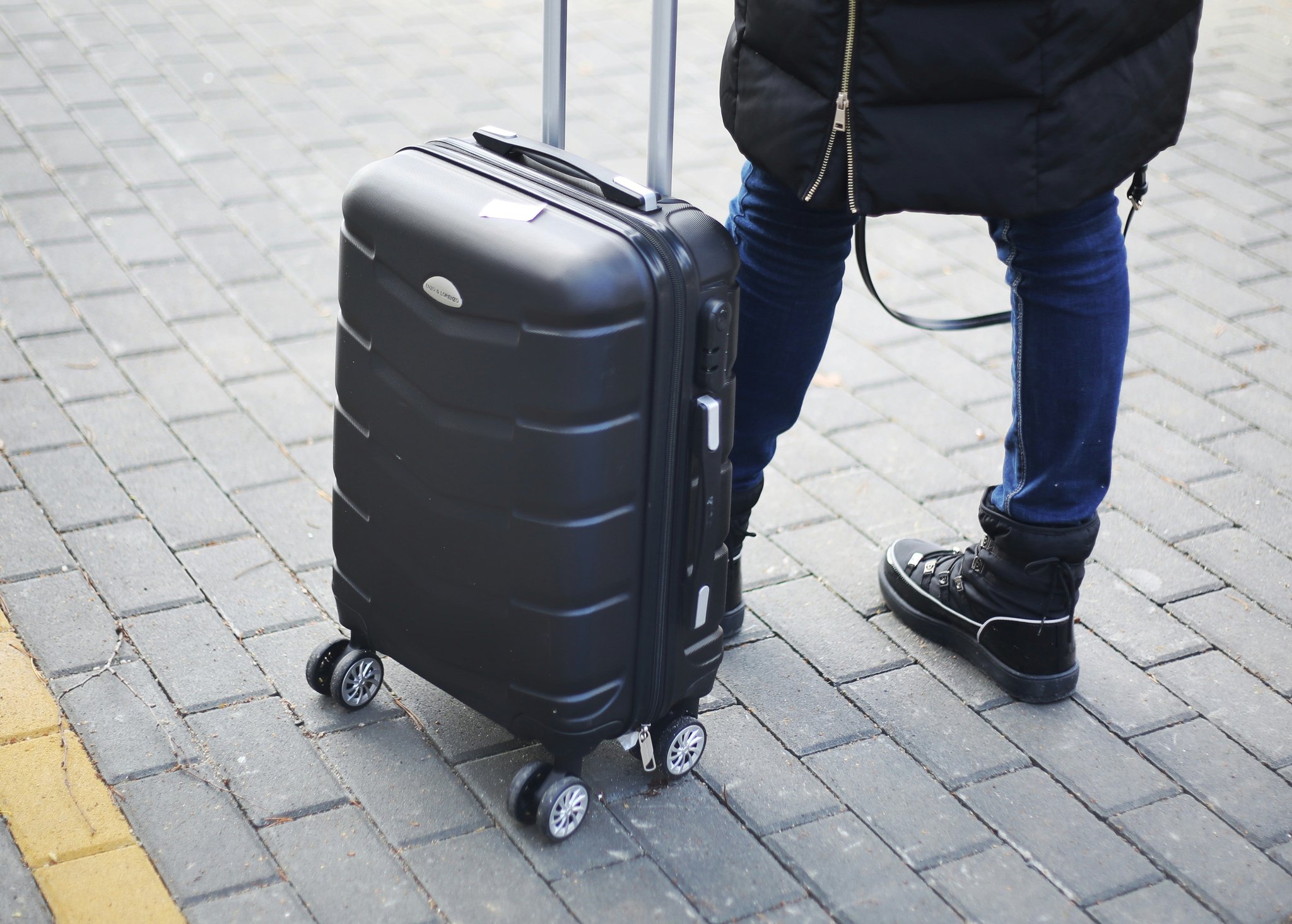 Damaged exterior of a hardshell suitcase with intact interior