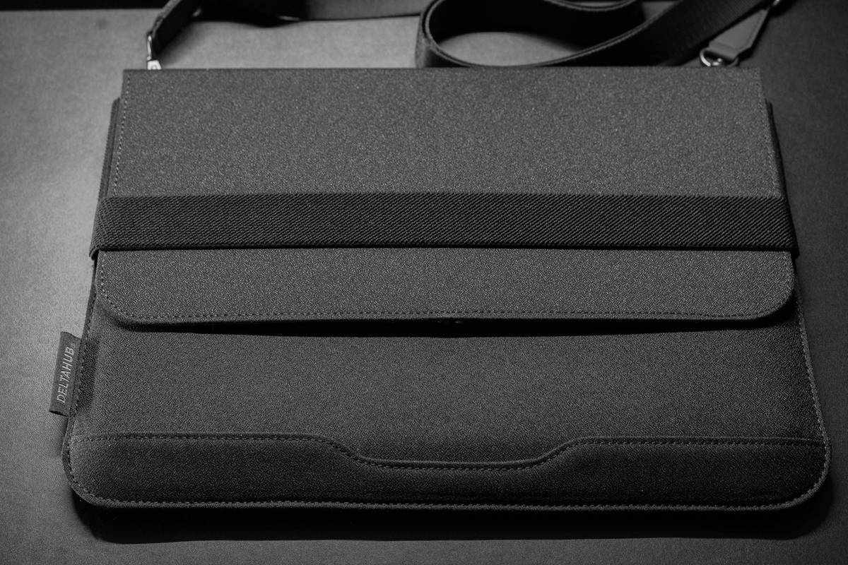 Person cleaning and maintaining their hardshell suitcase