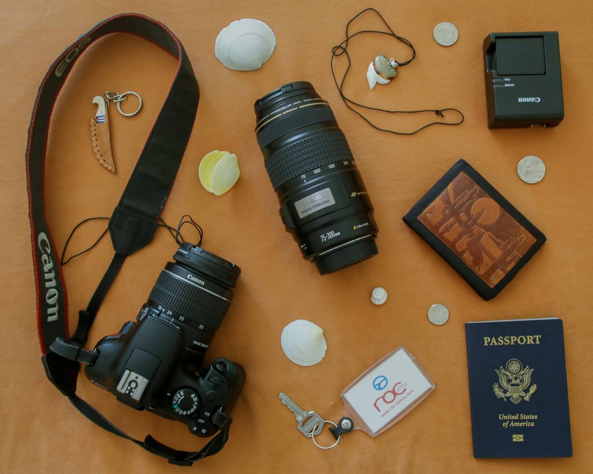 Travel blogger posing with her armored travel case in an airport